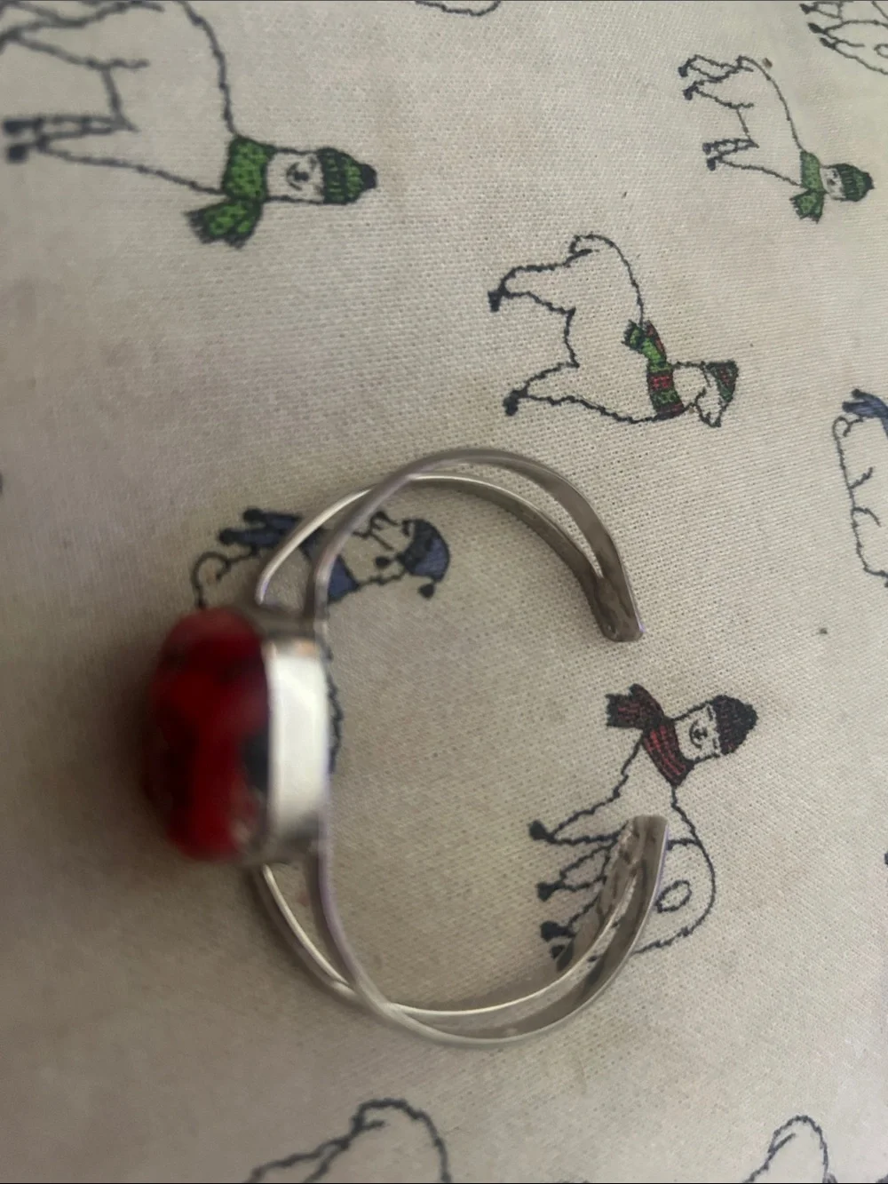 Silver bracelet with rough coral stone.